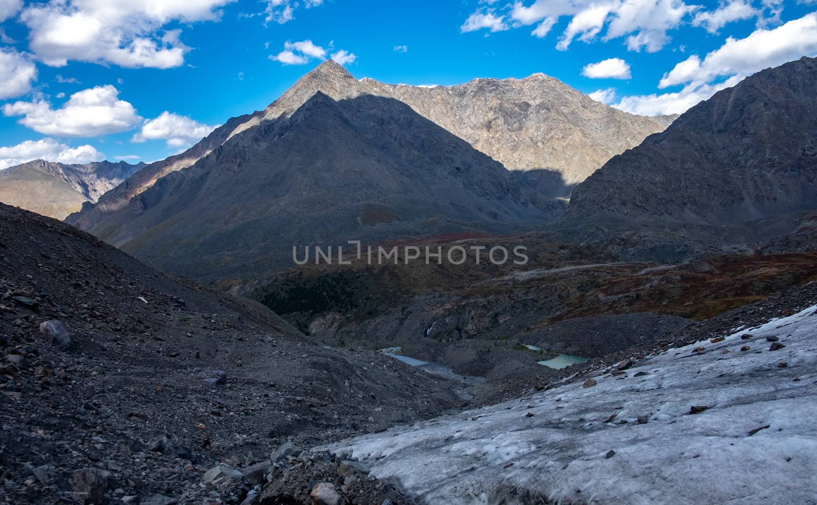 Glacier on the background of mountain peaks in the Altai Republic.