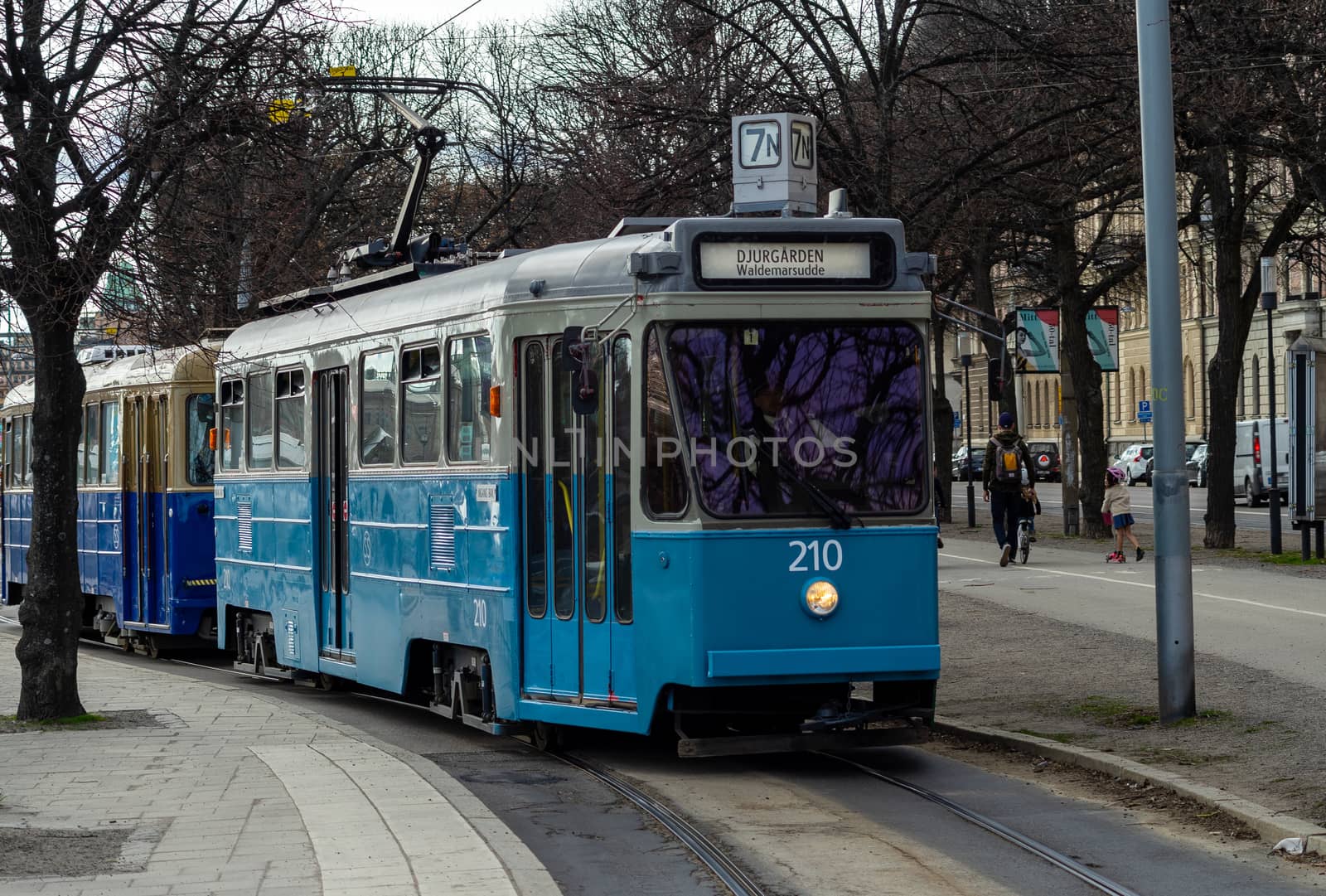 April 22, 2018, Stockholm, Sweden. Blue tram on one of the streets of Stockholm in spring clear weather.