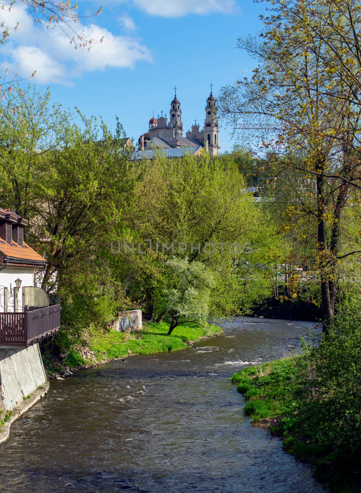 April 27, 2018 Vilnius, Lithuania, Vilnius River and Catholic church of the Ascension in Vilnius in the spring in fine weather.