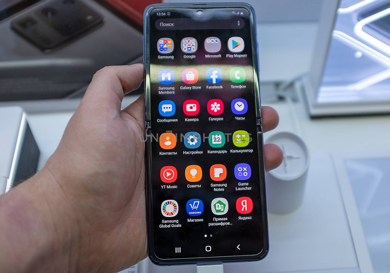 February 22, 2020, Moscow, Russia. New folding smartphone with a folding screen Samsung Galaxy Z Flip on the store counter.