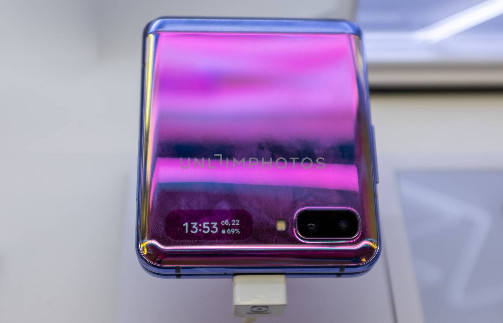 February 22, 2020, Moscow, Russia. New folding smartphone with a folding screen Samsung Galaxy Z Flip on the store counter.
