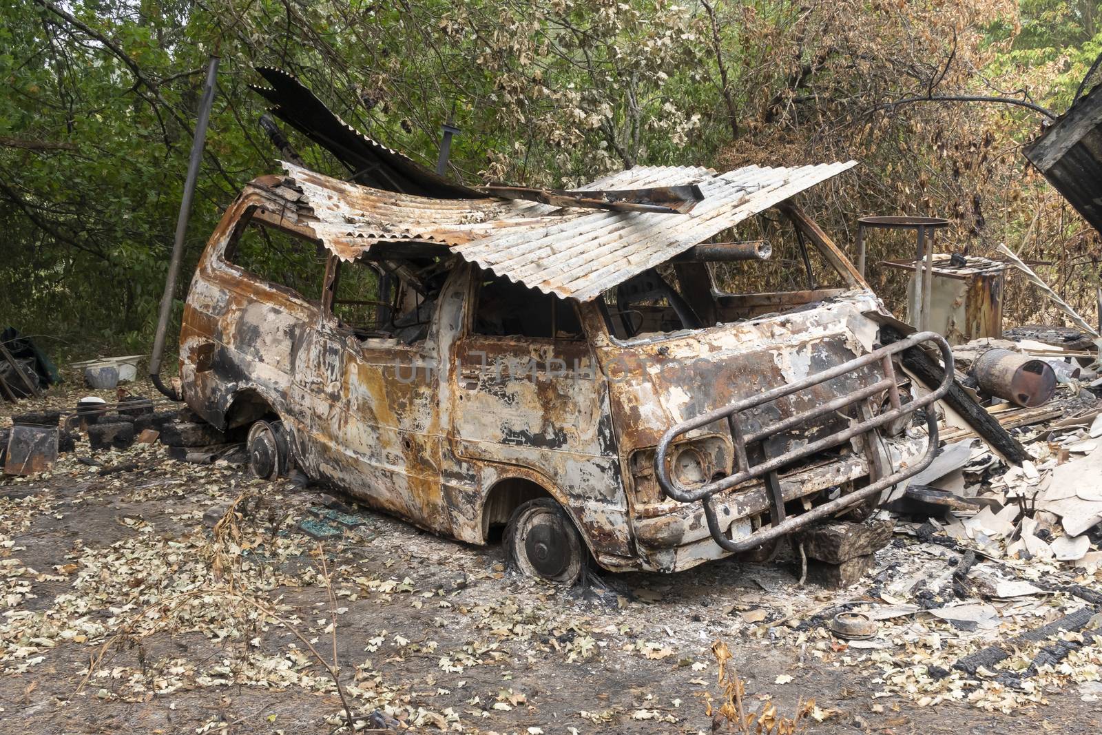 A burnt vehicle due to bushfire in The Blue Mountains in regional Australia by WittkePhotos
