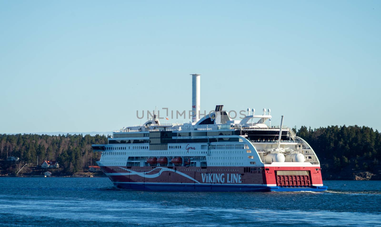 22 April 2019, Stockholm, Sweden. High-speed passenger and car ferry of the Finnish shipping concern Viking Line Viking Grace equipped with rotary sail in Stockholm skerries.