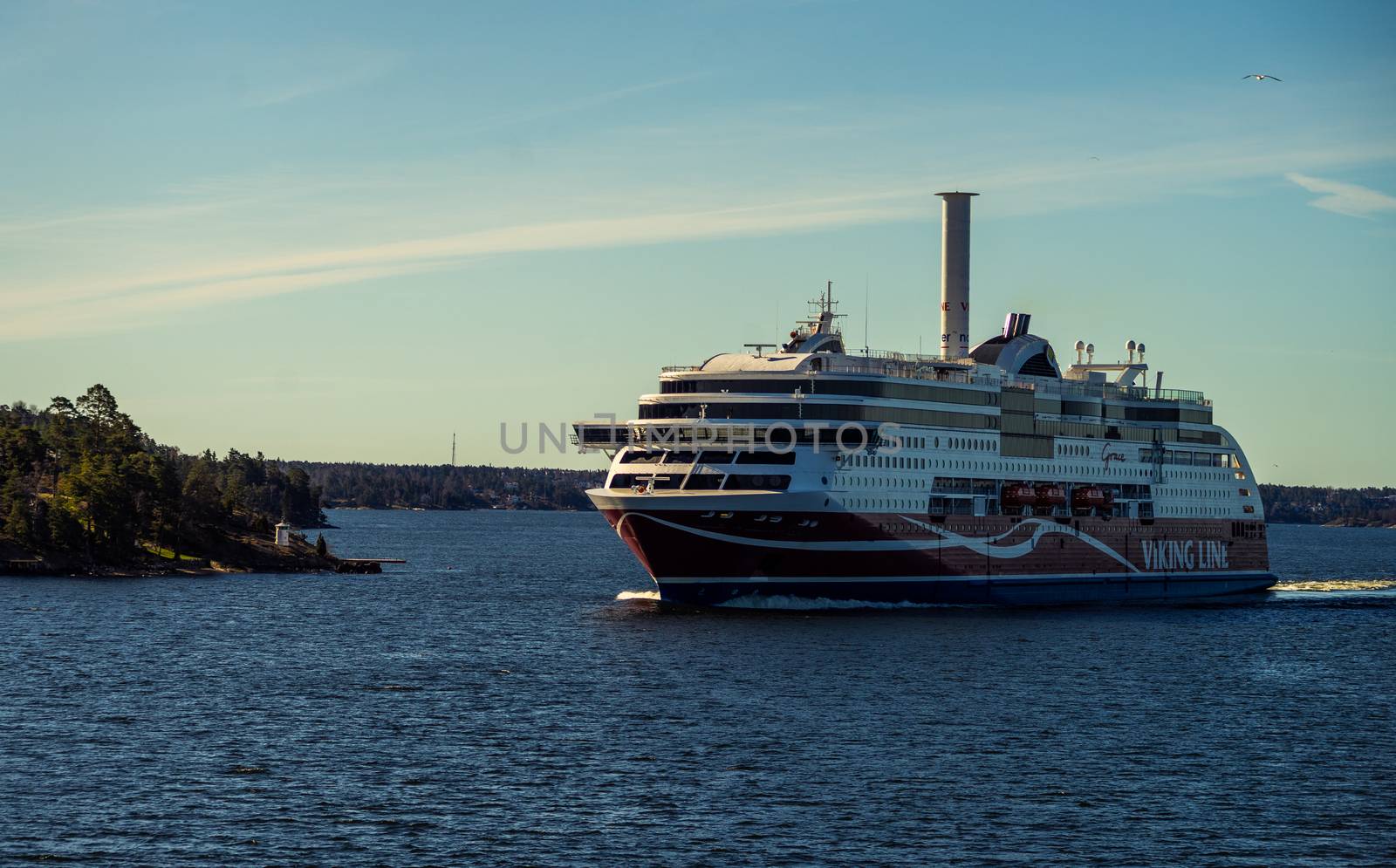 22 April 2019, Stockholm, Sweden. High-speed passenger and car ferry of the Finnish shipping concern Viking Line Viking Grace equipped with rotary sail in Stockholm skerries.