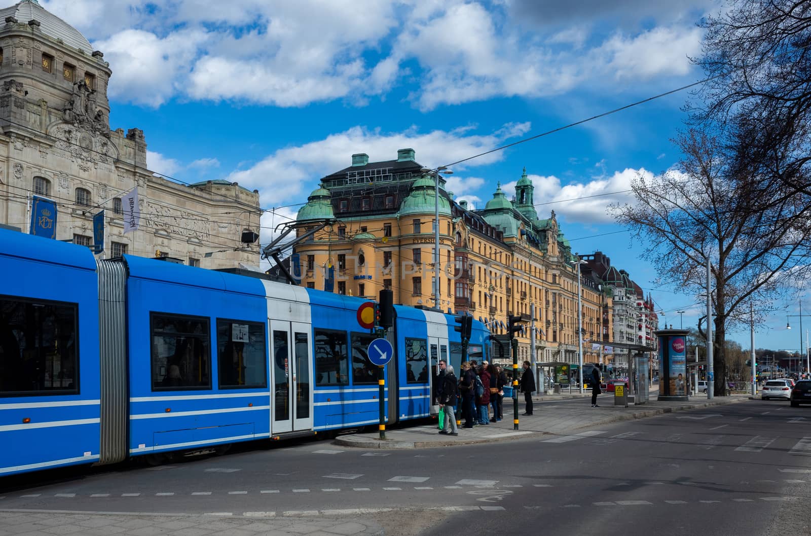 April 22, 2018, Stockholm, Sweden. Blue tram on one of the streets of Stockholm in spring clear weather.
