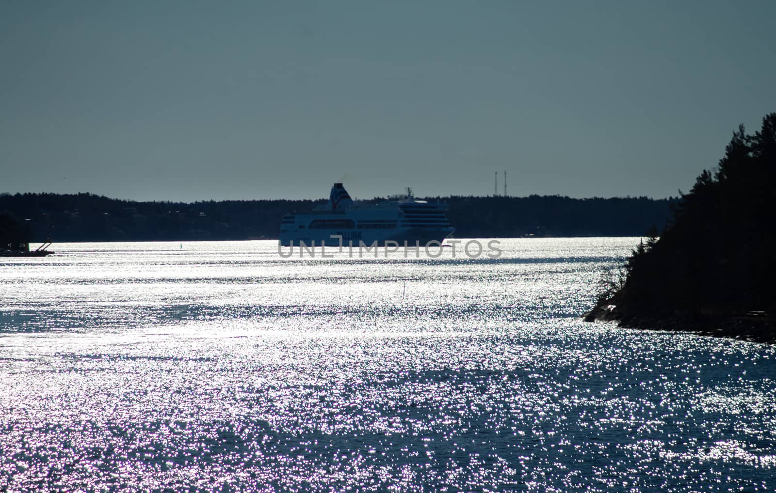 22 April 2019, Stockholm, Sweden. High-speed passenger and car ferry of the Estonian shipping concern Tallink Romantika  equipped with rotary sail in Stockholm skerries.
