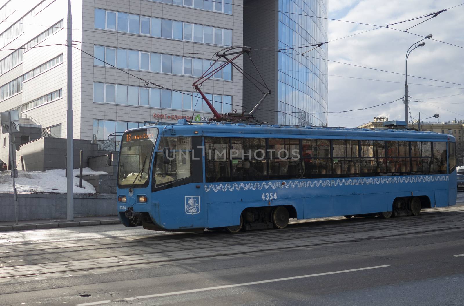 March 10, 2019 Moscow, Russia Blue tram on a street in Moscow in cloudy weather.