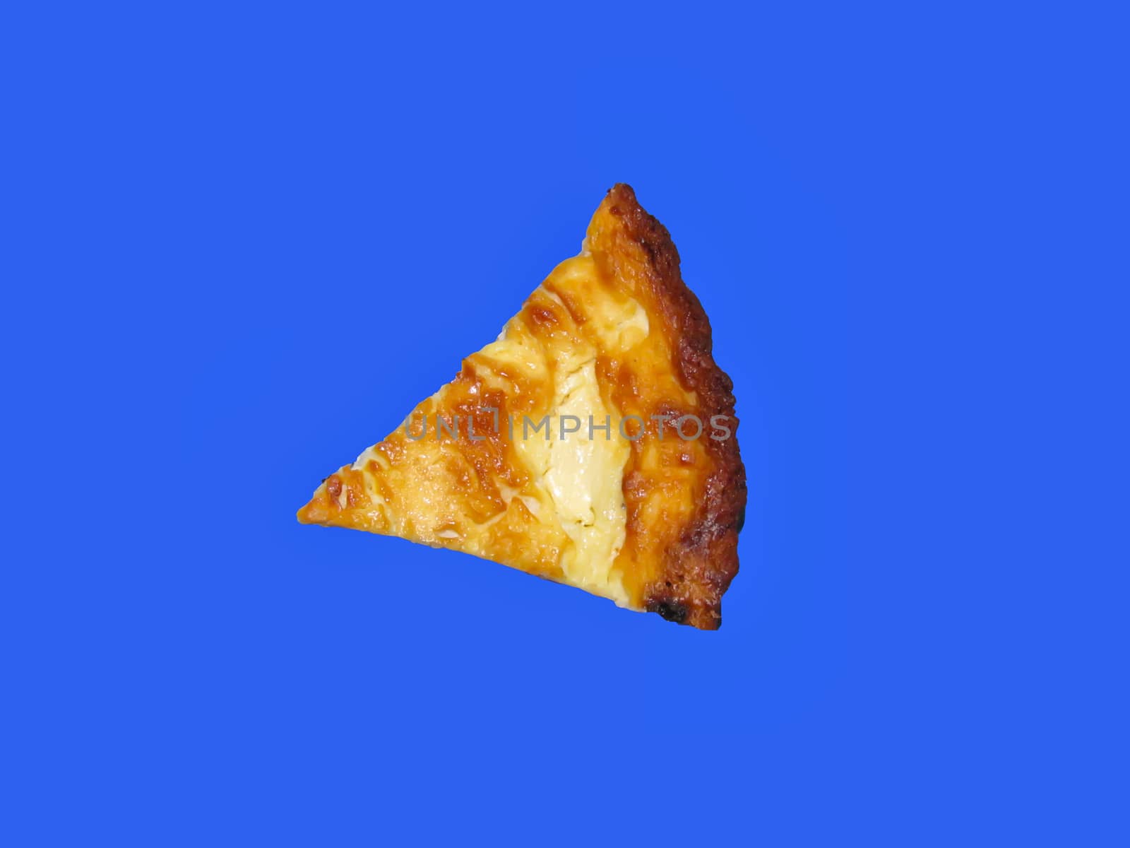 triangular piece of curd casserole on a blue background