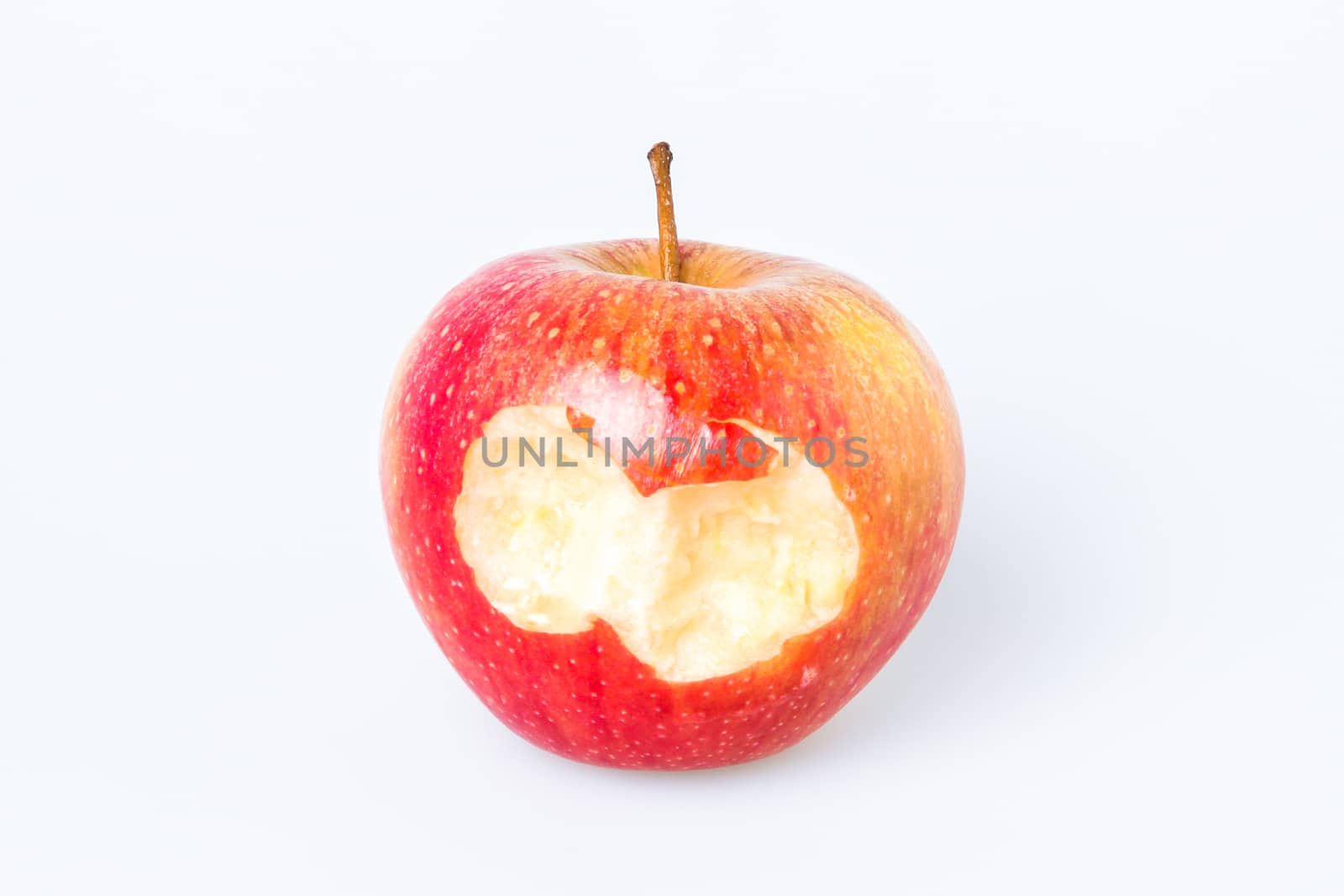 Organic bitten apple isolated on white background