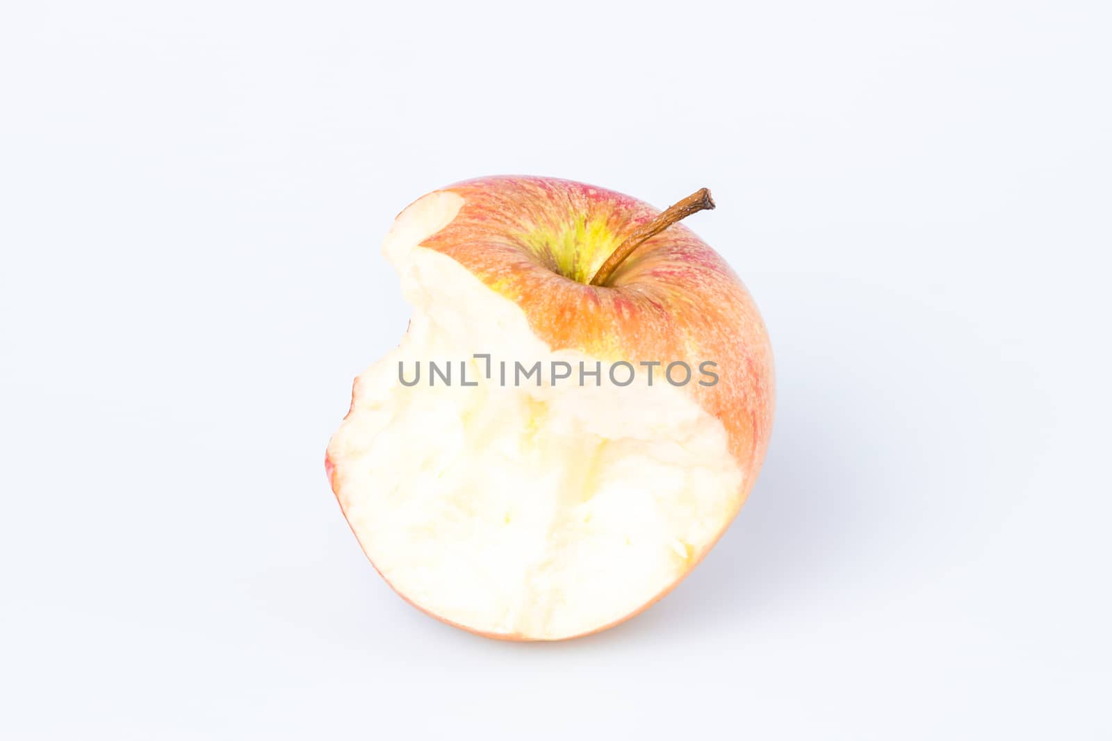 Organic bitten apple isolated on white background