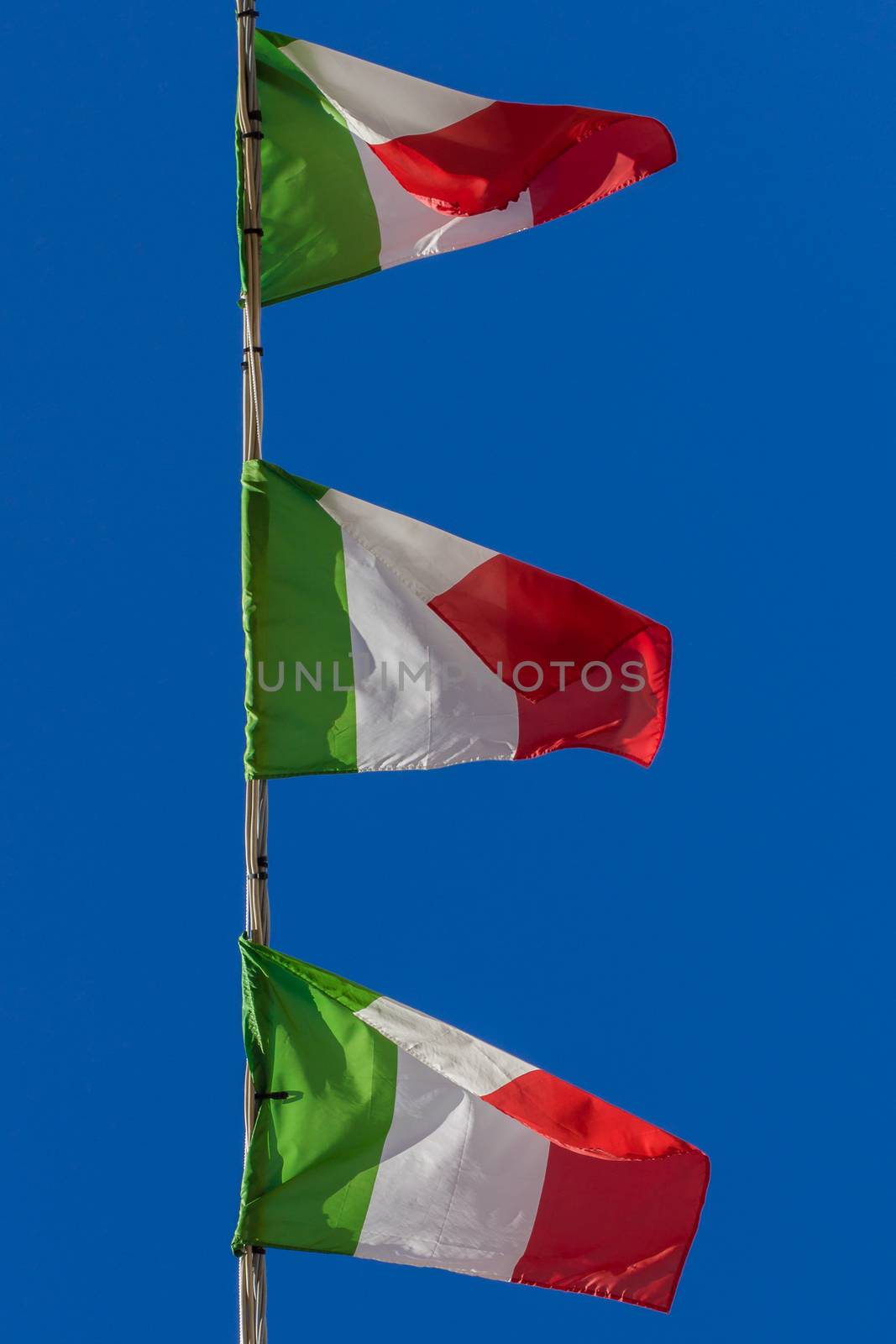 Small Italian flags related to a high-tension wire.