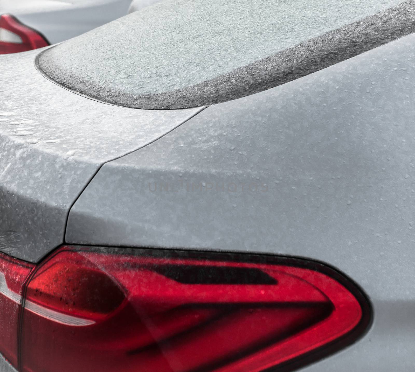 Frozen car during winter day