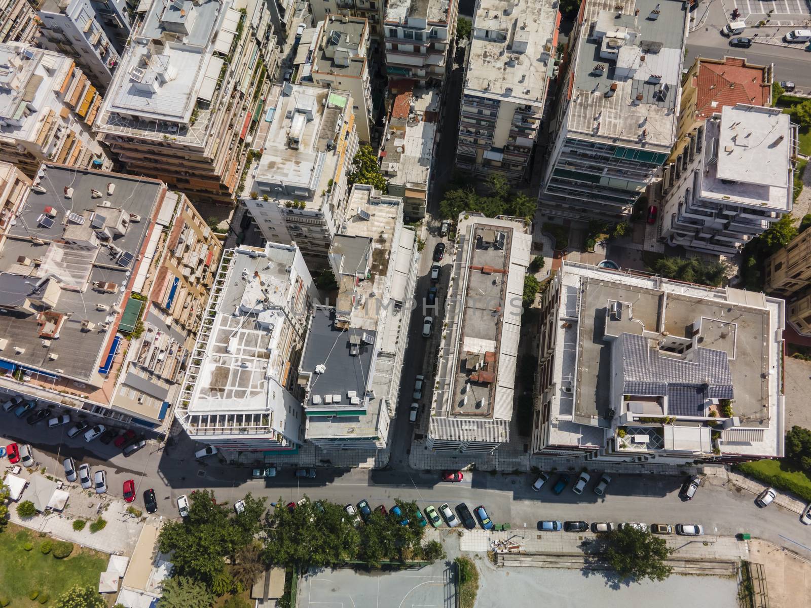 Day top panorama of European city with residential blocks of flats on a sunny day.