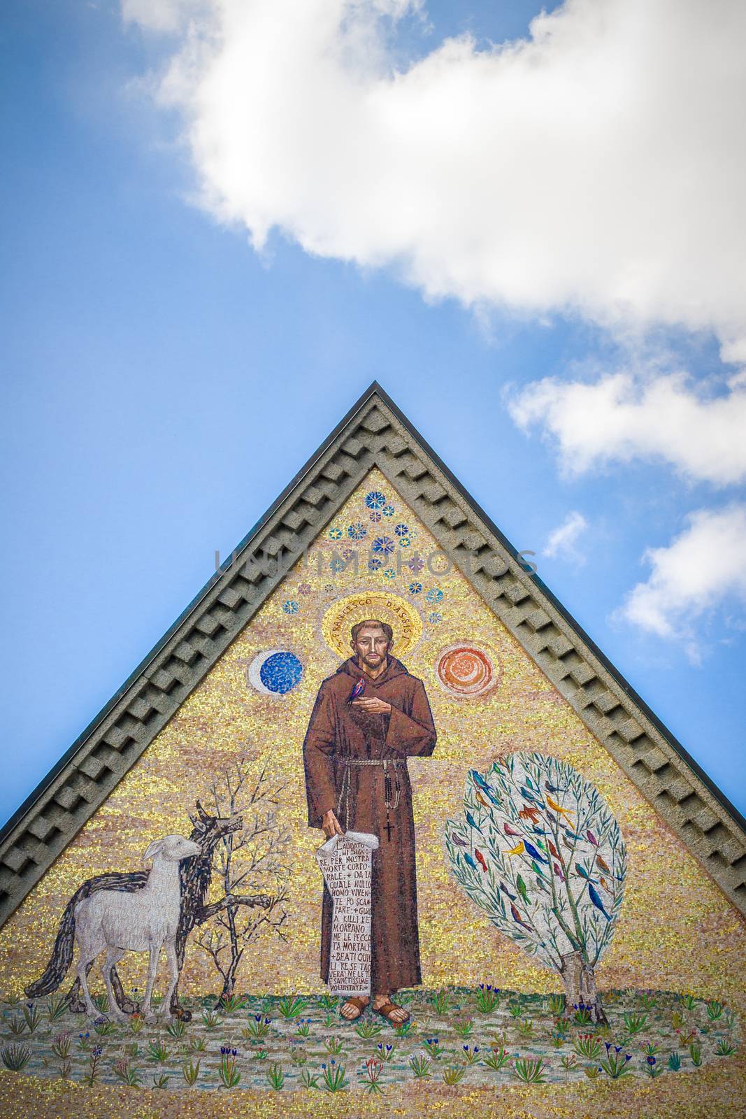 Triangular mosaic depicting St. Francis of Assisi, pointing skyward.