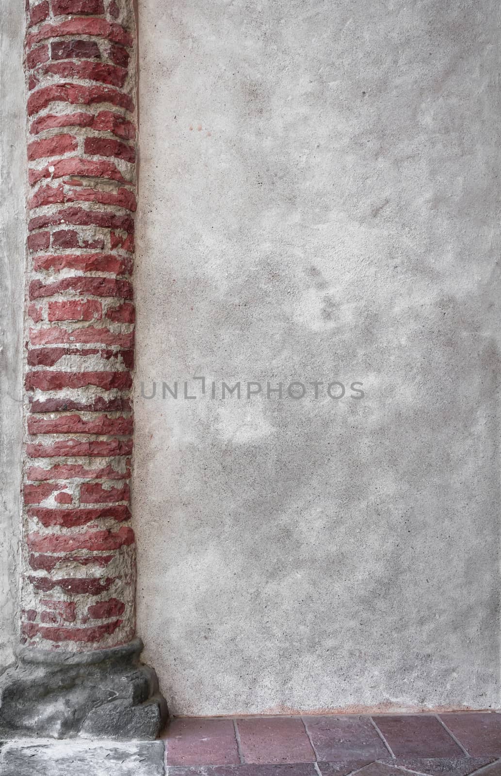 Architectural column on an old wall