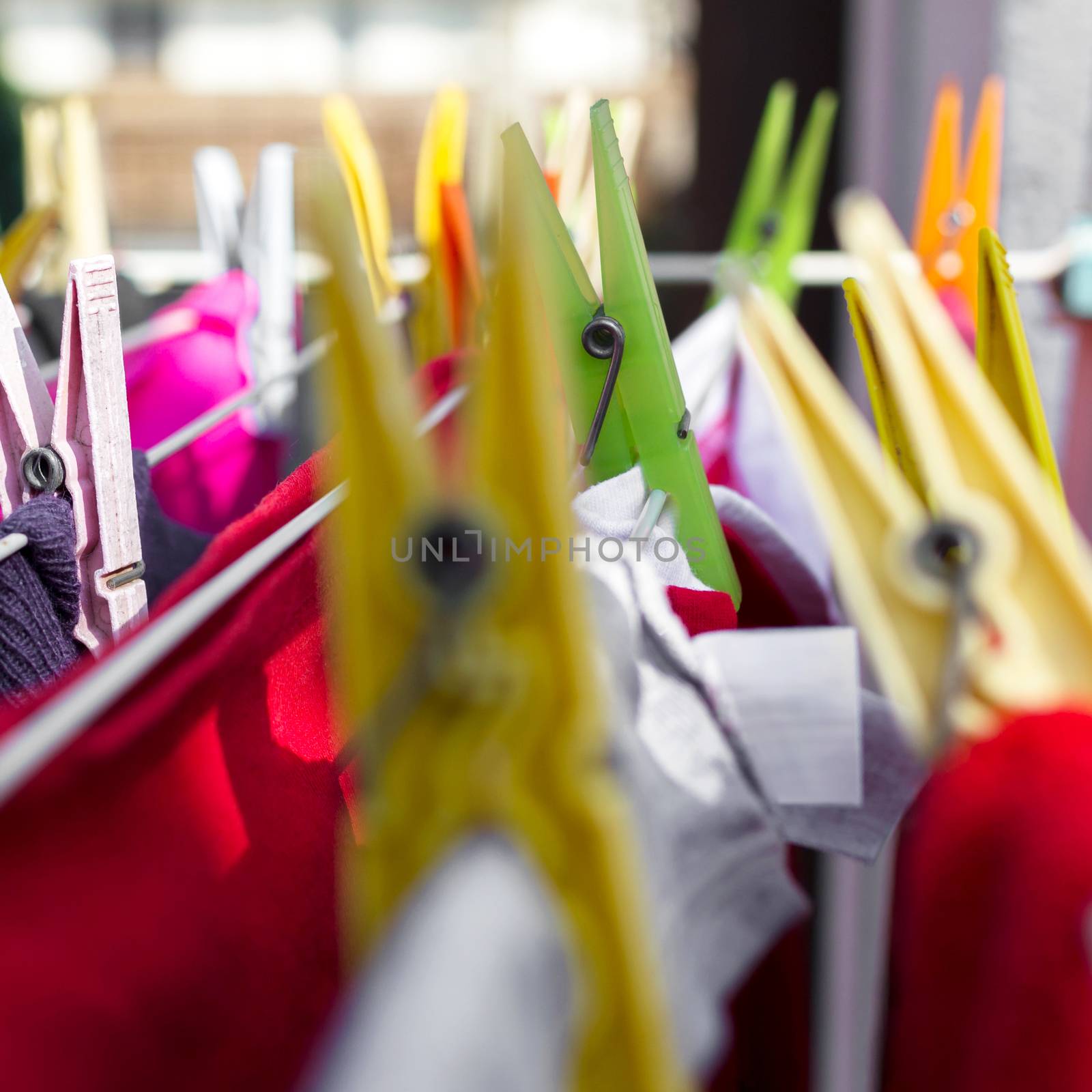 Clothes pegs on washing line. Extreme close-up. Defocused blurry background.