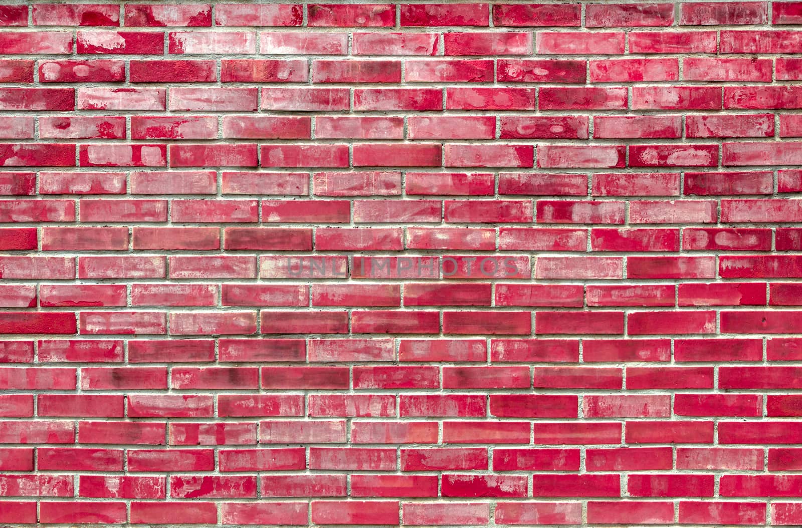Bright colorful pink/red brick wall