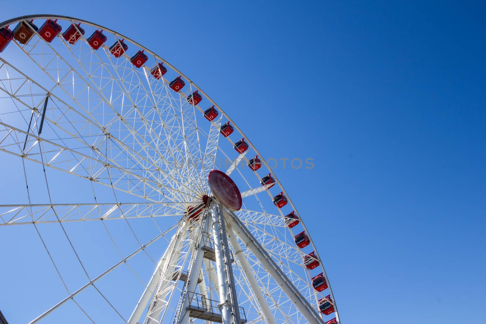 Jesolo, Italy, July 19 2016: ferris wheel on blue sky background.