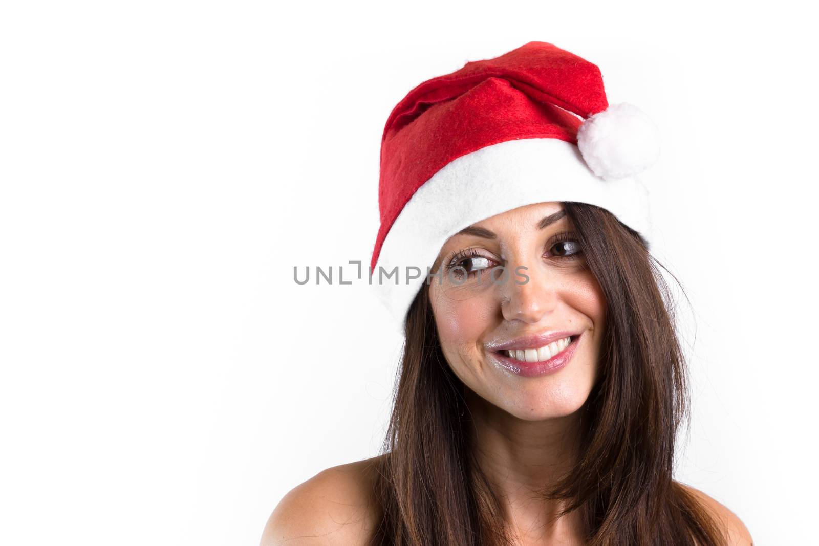 Beautiful female model, with brown hair, wear santa hat. Isolated over a white background.
