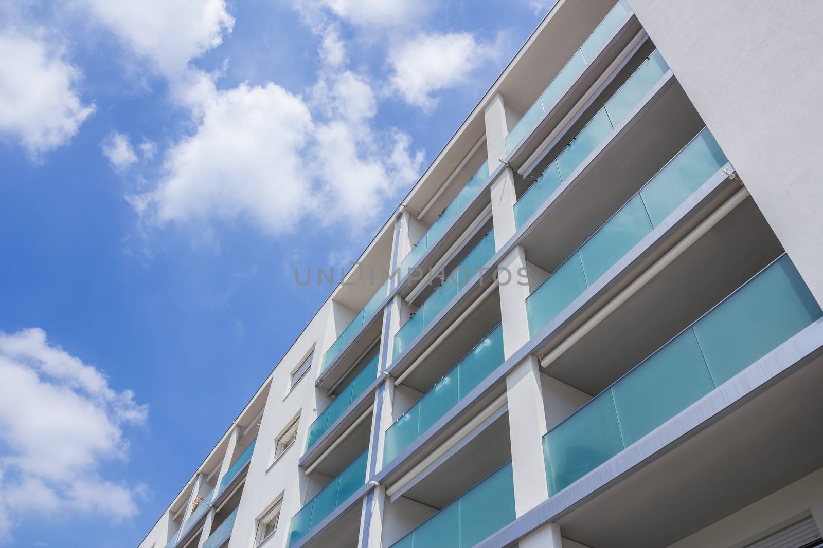 Modern apartment buildingn on a sunny day with a blue sky. Facade of a new apartment building.