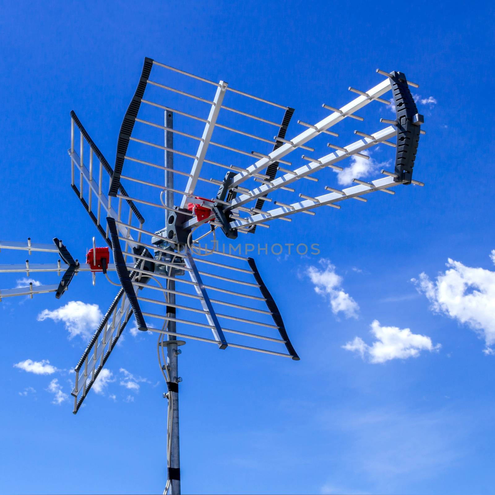 TV antenna for receiving terrestrial television UHF band against the blue sky