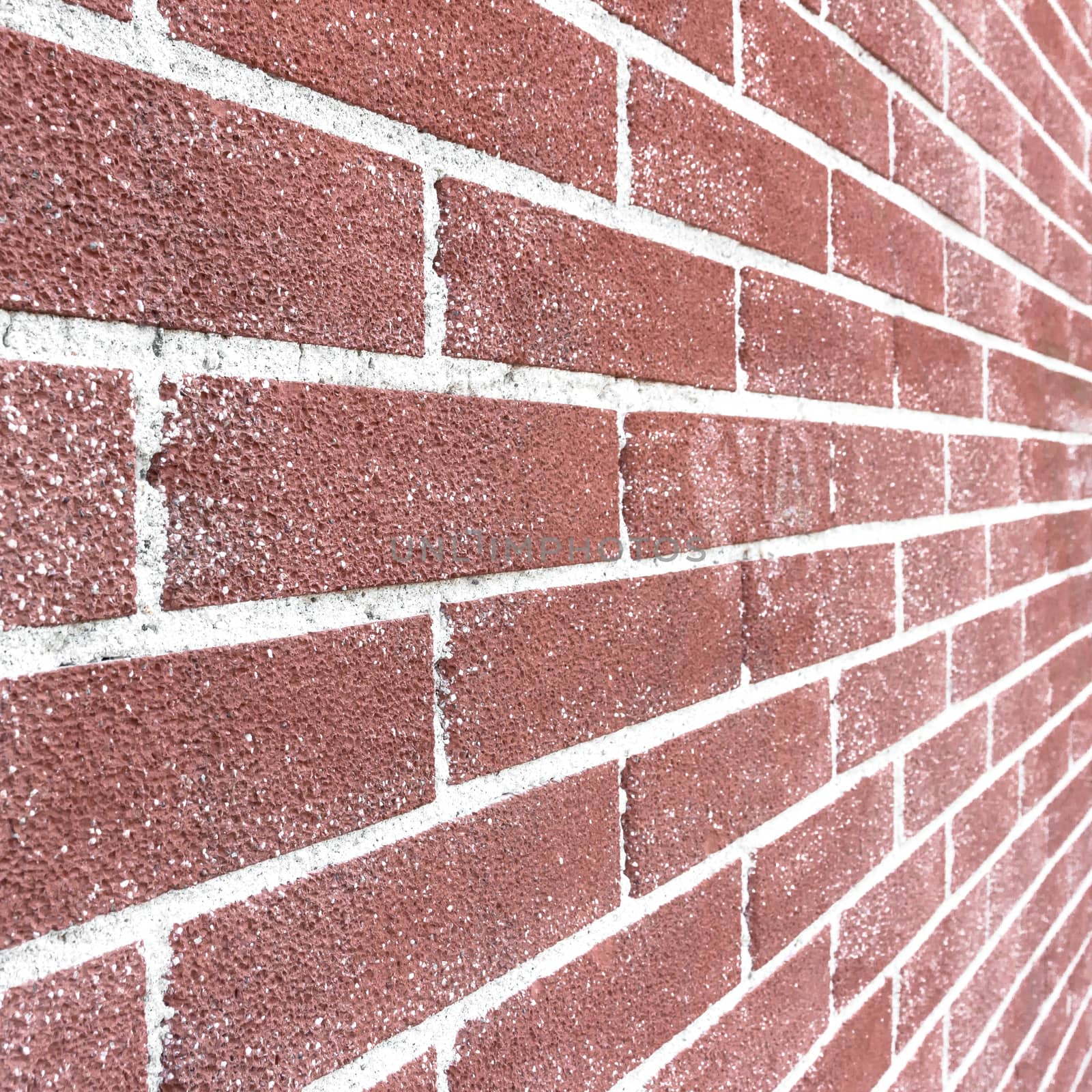 Close up of brick wall ending in infinity by germanopoli