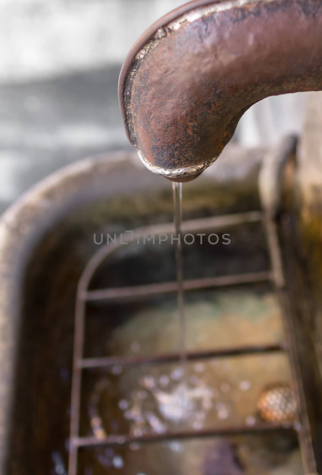 Close-up of an old fountain. by germanopoli