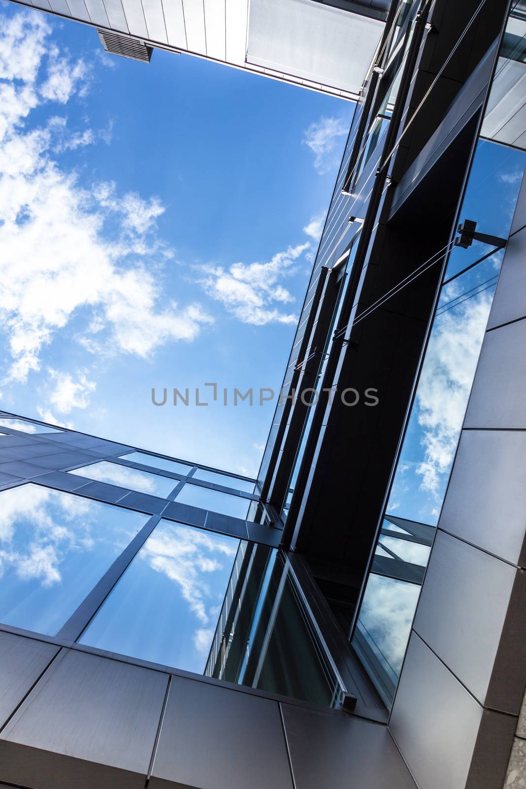 Bottom view of modern office building with amazing sky for copy space