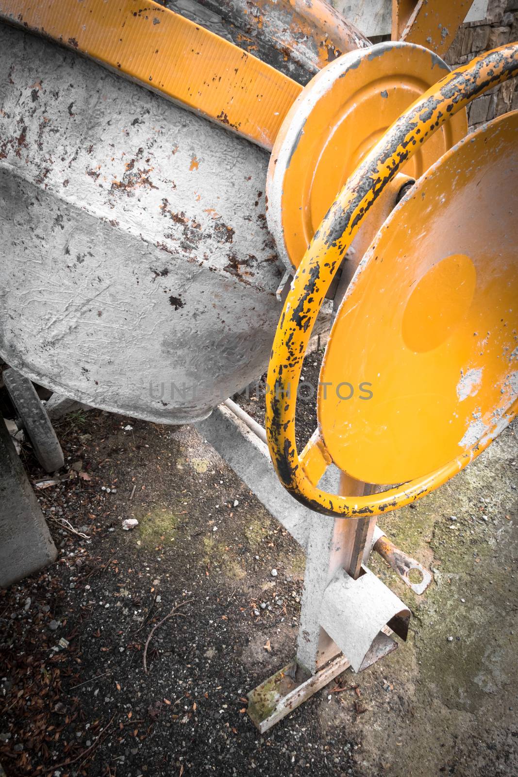 Close - up of cement mixer at a construction site. Work in progress.