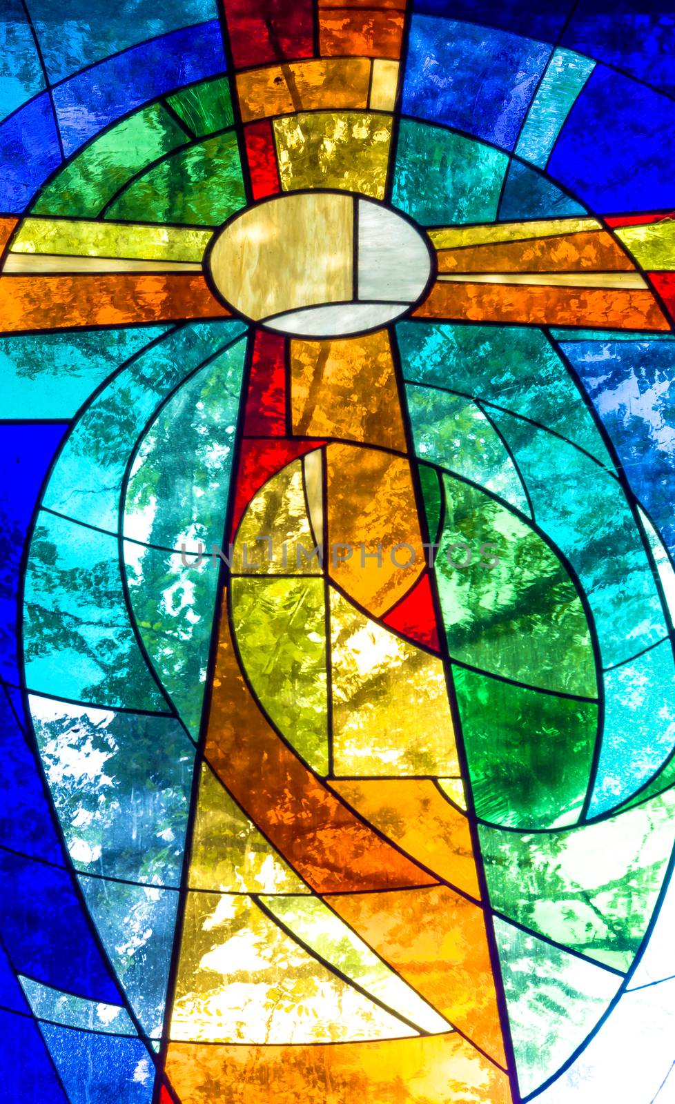 Stained glass cross in bright vivid colors by germanopoli