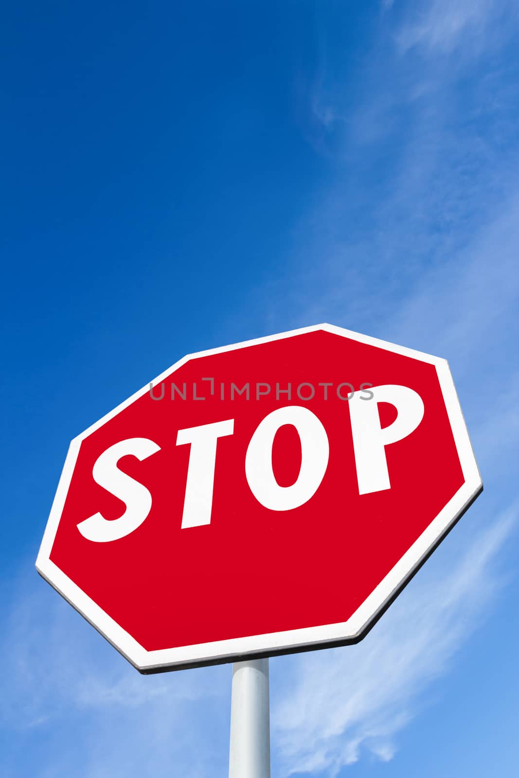 Stop sign against a blue sky