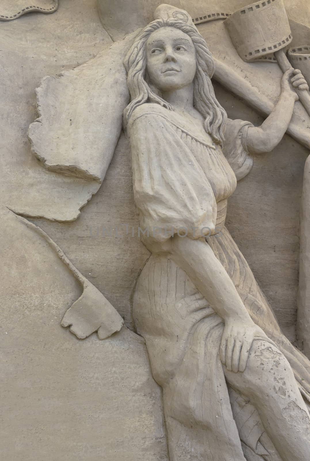 Sand sculpture of a woman. It can be used as background.