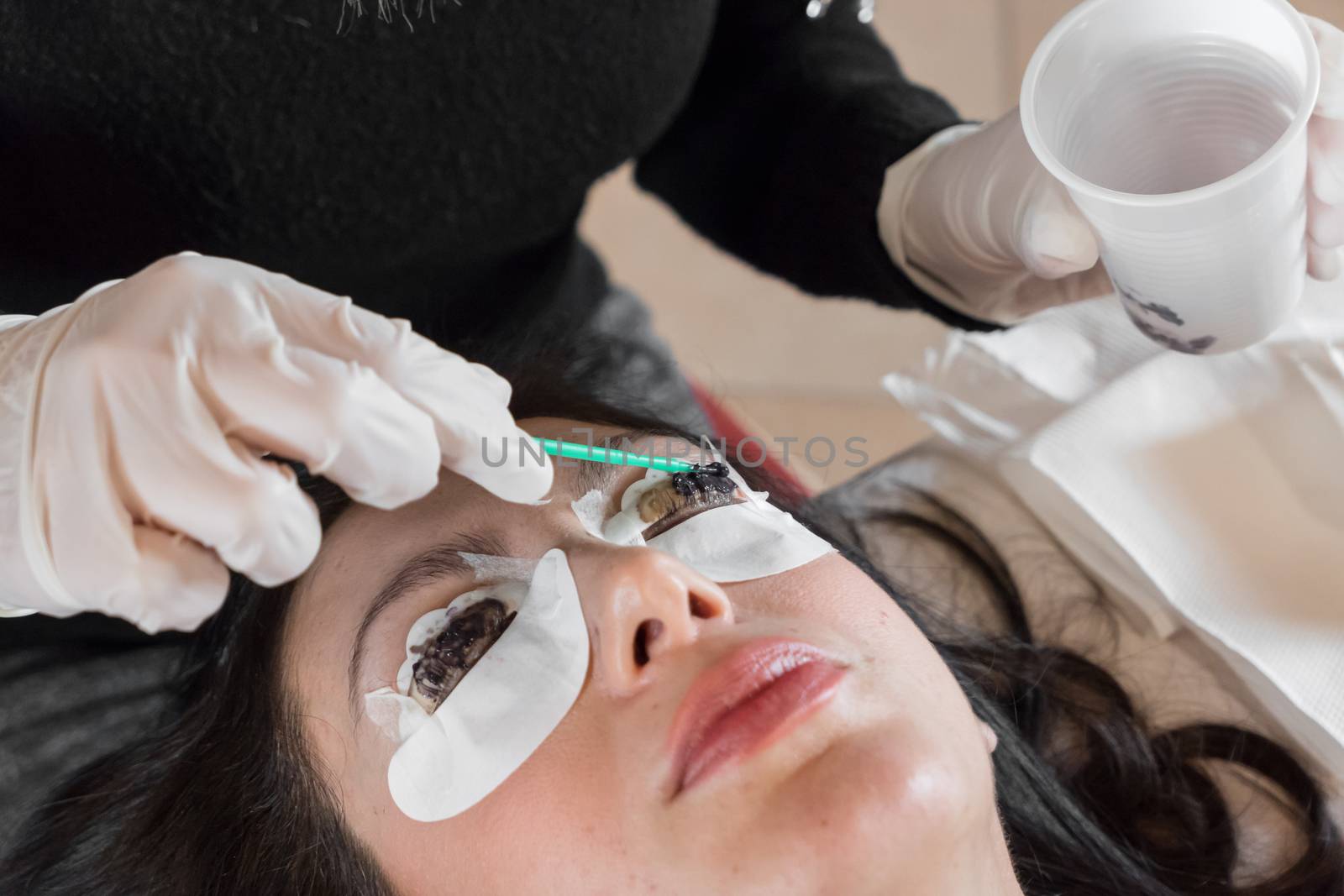 Cosmetic procedure of dyeing and lamination of eyelashes. Extension, perm, lamination of eyelashes. Eyelash care.