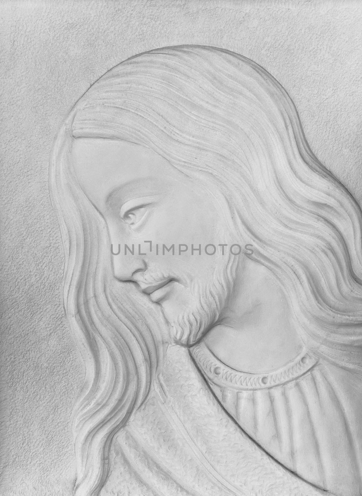 White stone Bas-relief of Christ smiling. Ideal for concepts and backgrounds.