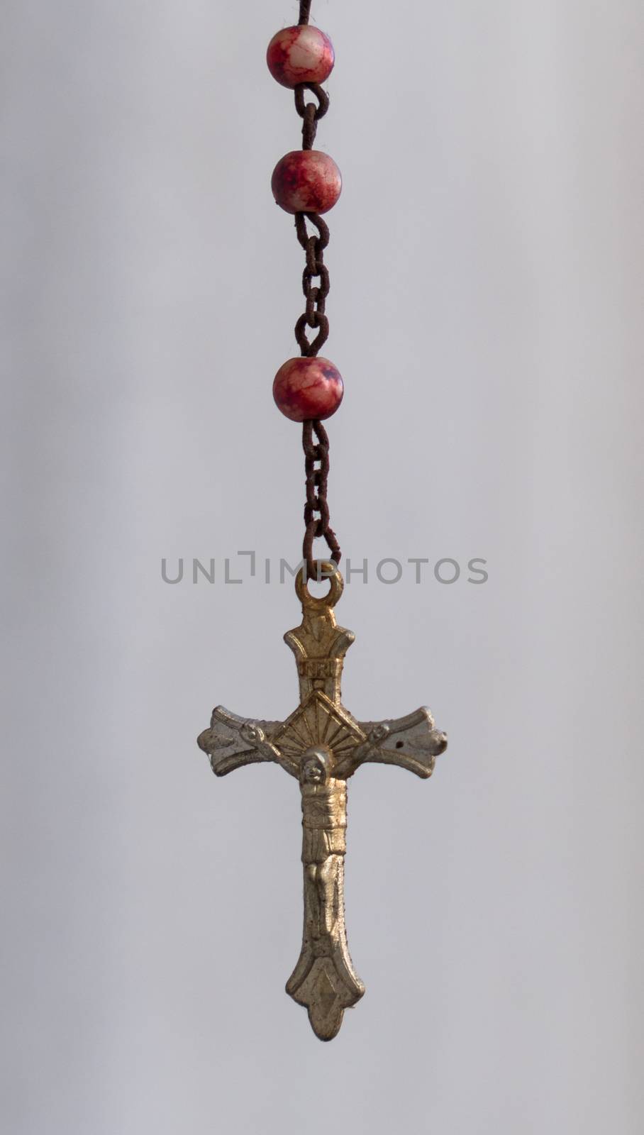 Rosary on a white background by germanopoli