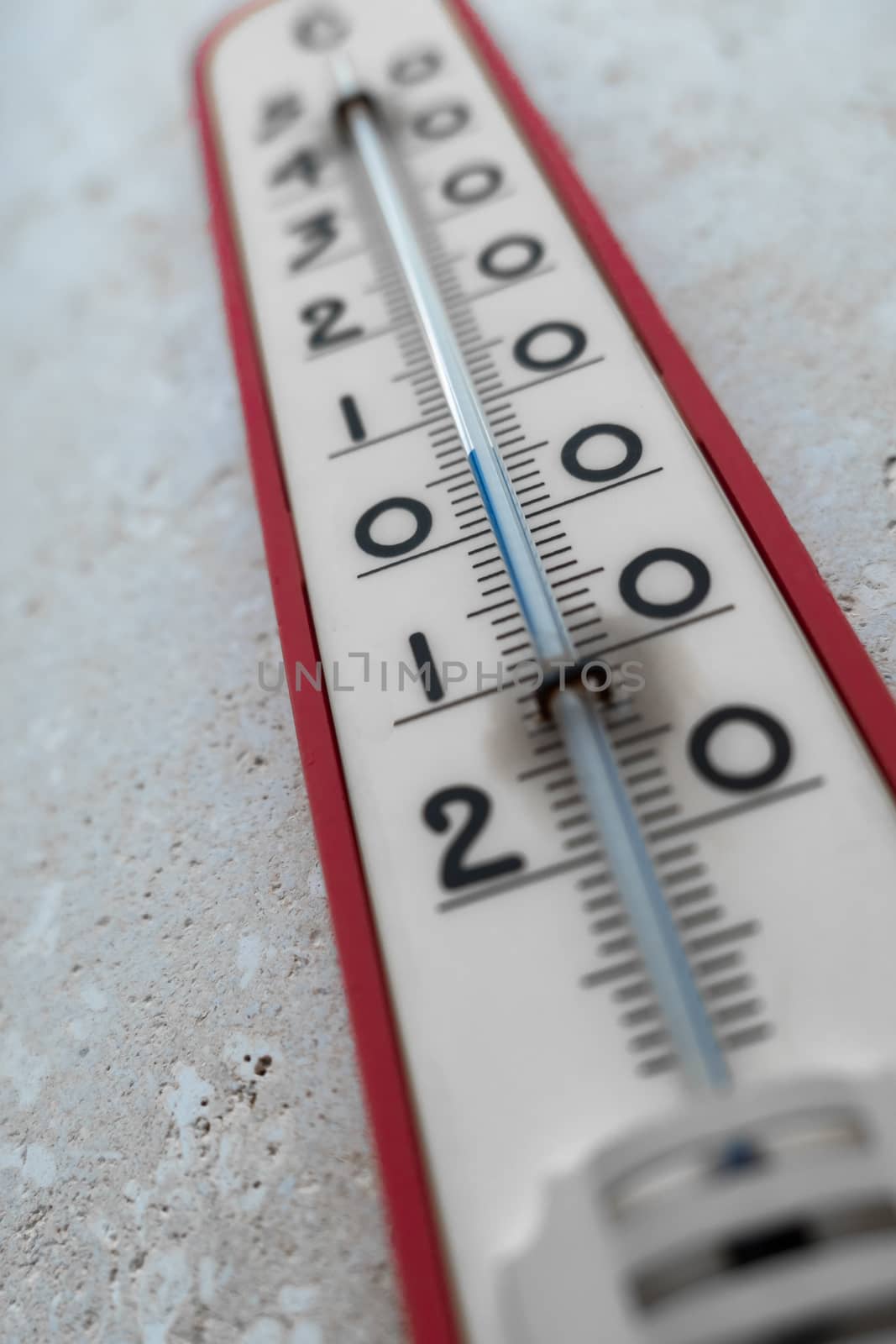 Close - up of Big external thermometer on a wall. Selective focus.