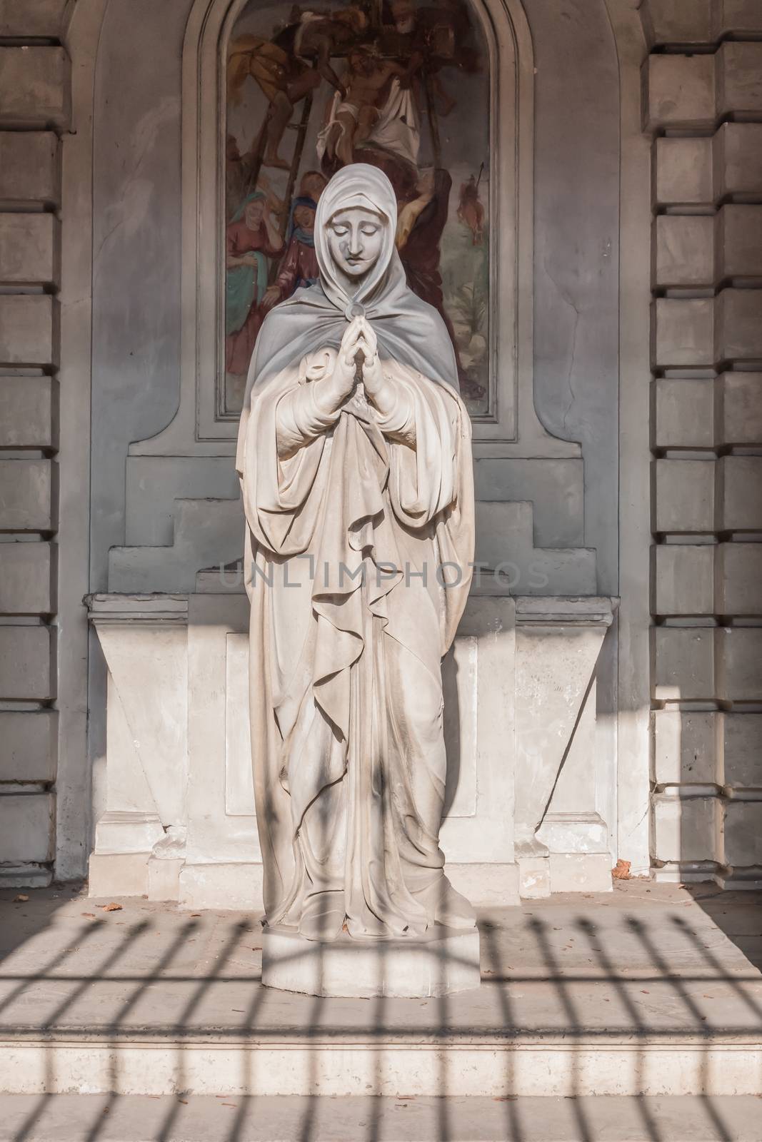 Bloody statue of the Madonna. Strong concept of suffering, birth, life and death.