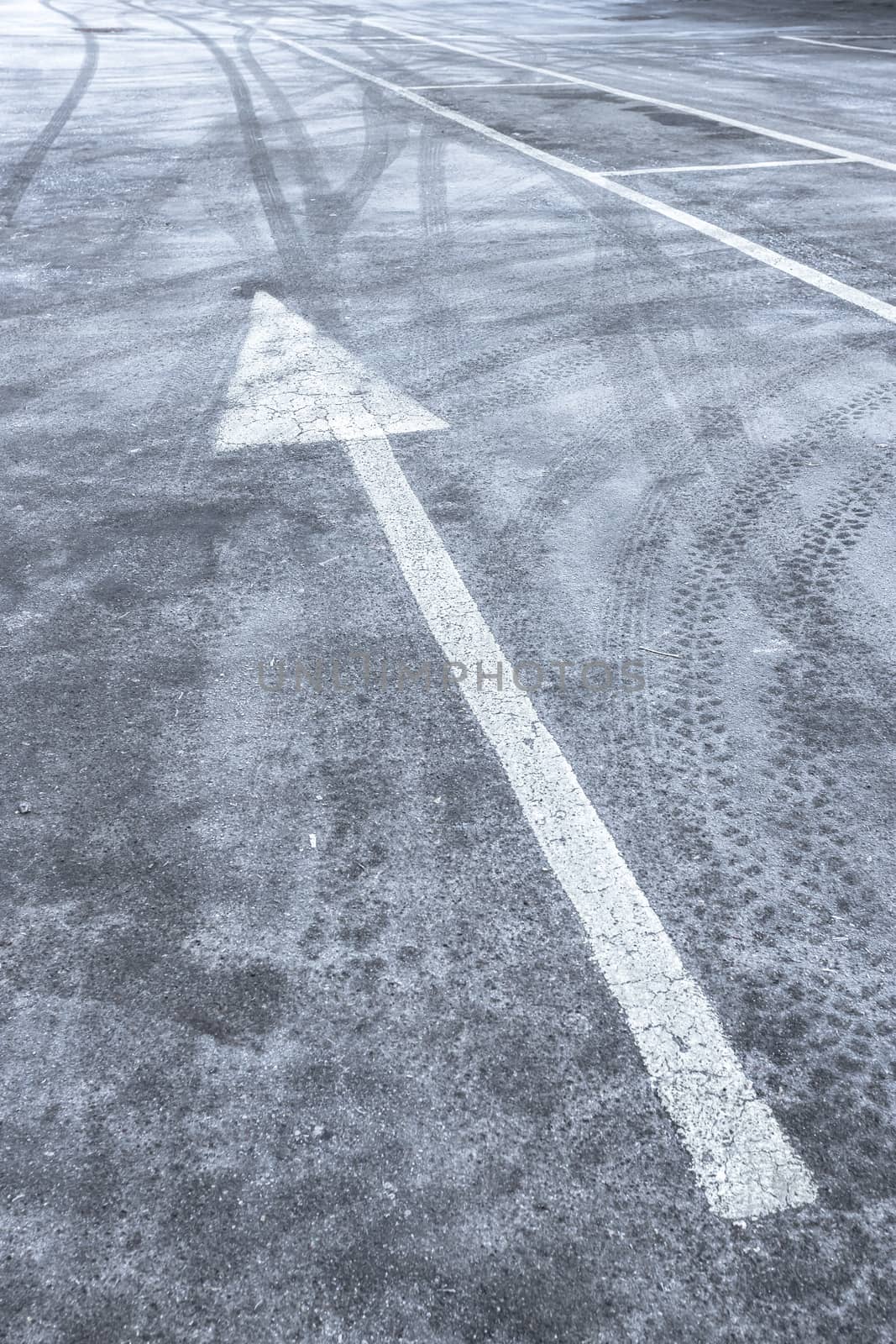 Icy road in winter with wheel print. Danger - safety.