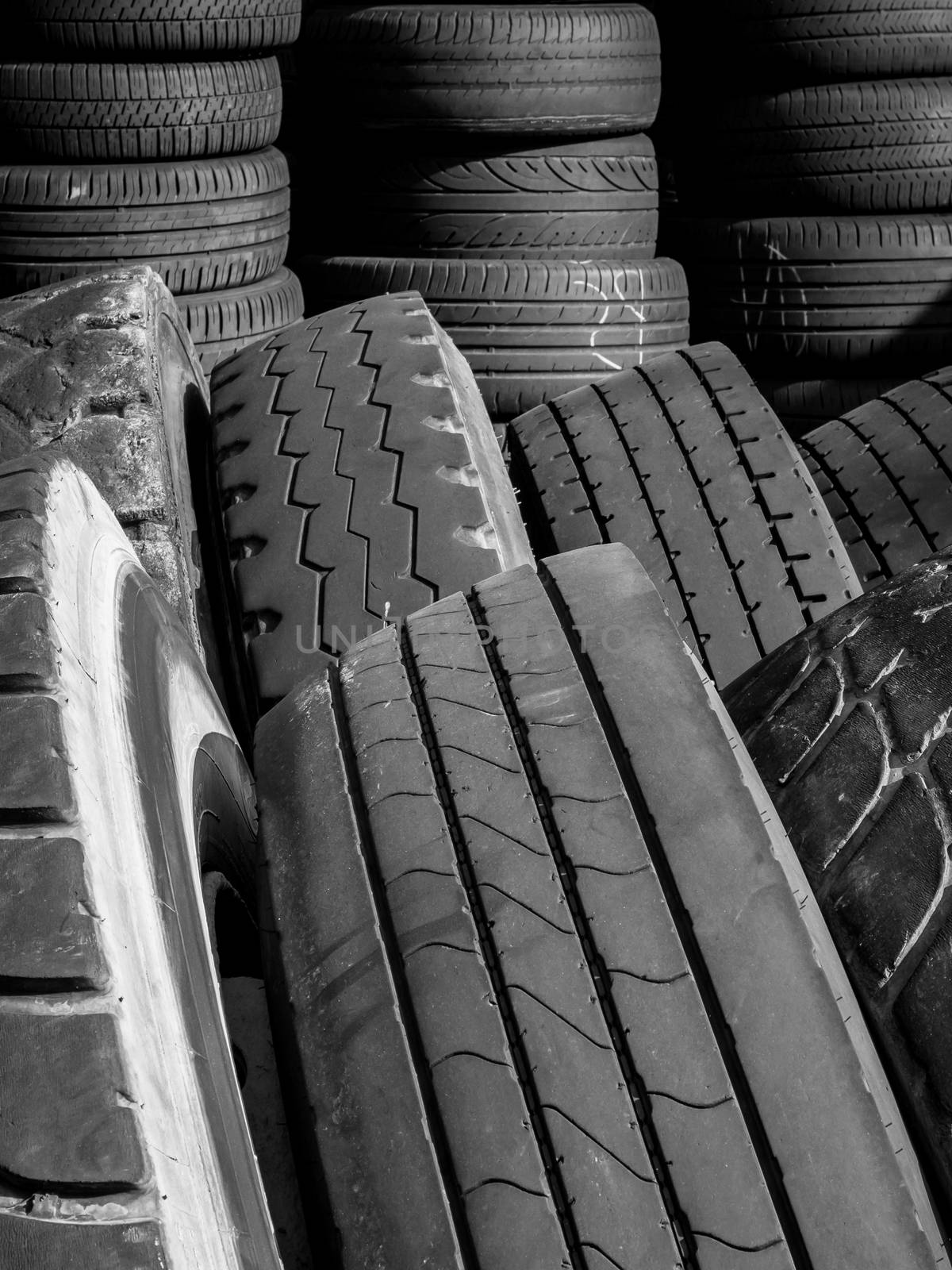 Stacks of old used tires by germanopoli