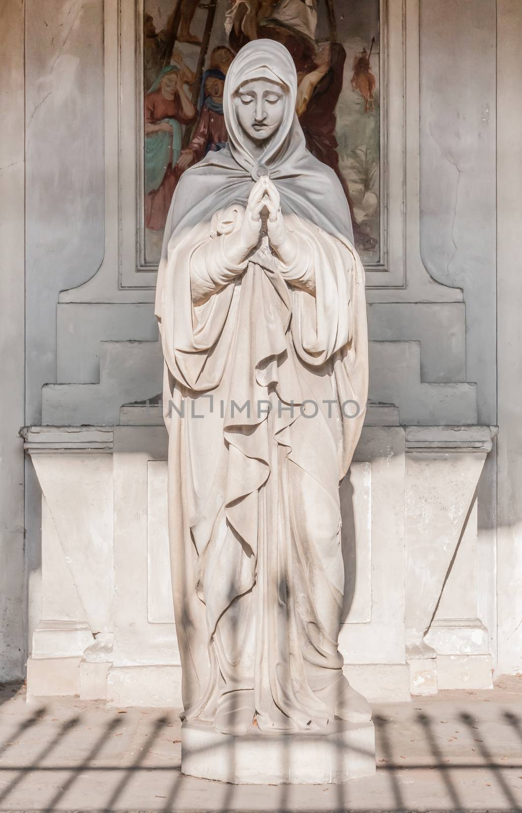 Statue of Mary with clasped hands. Ideal for Christmas and Easter concepts and other.