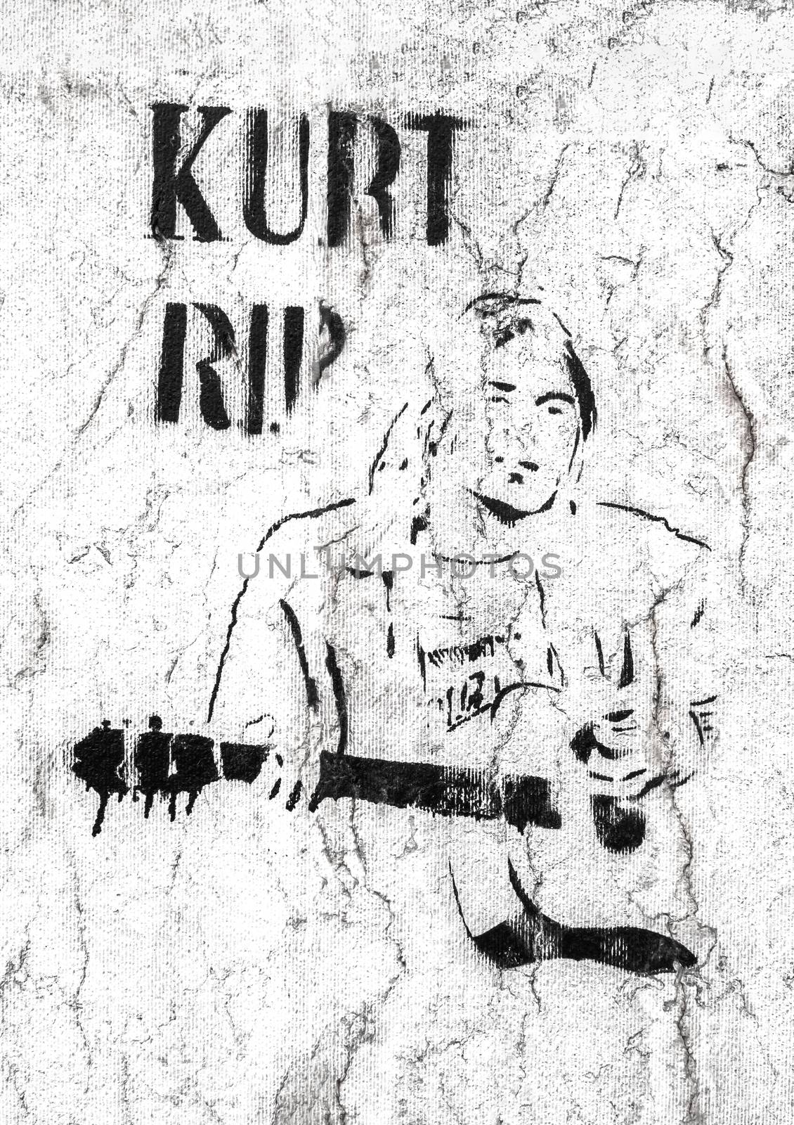 Kurt Cobain character. Graffiti / stencil on grungy wall. Bergamo, ITALY - May 20, 2019.