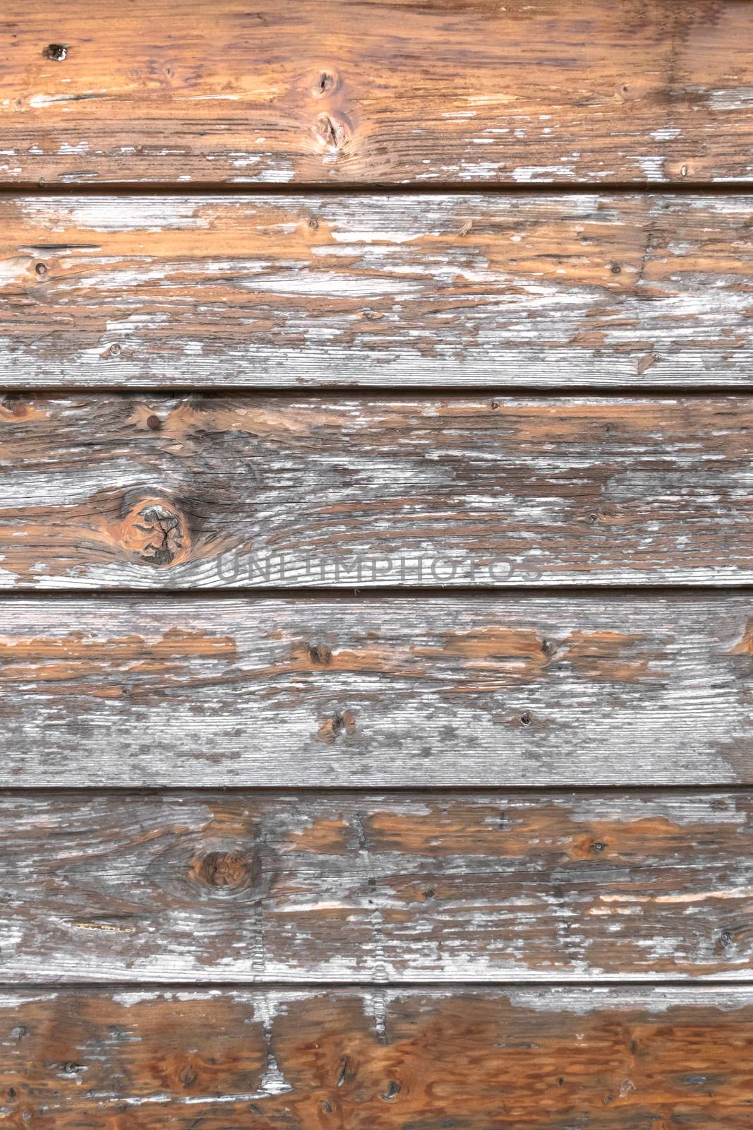 Rustic wooden background, scratched and damaged by time