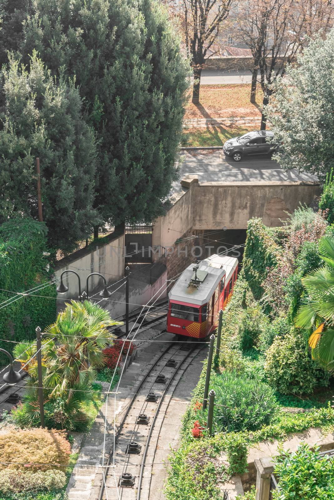 Red funicular in the old city of Bergamo by germanopoli