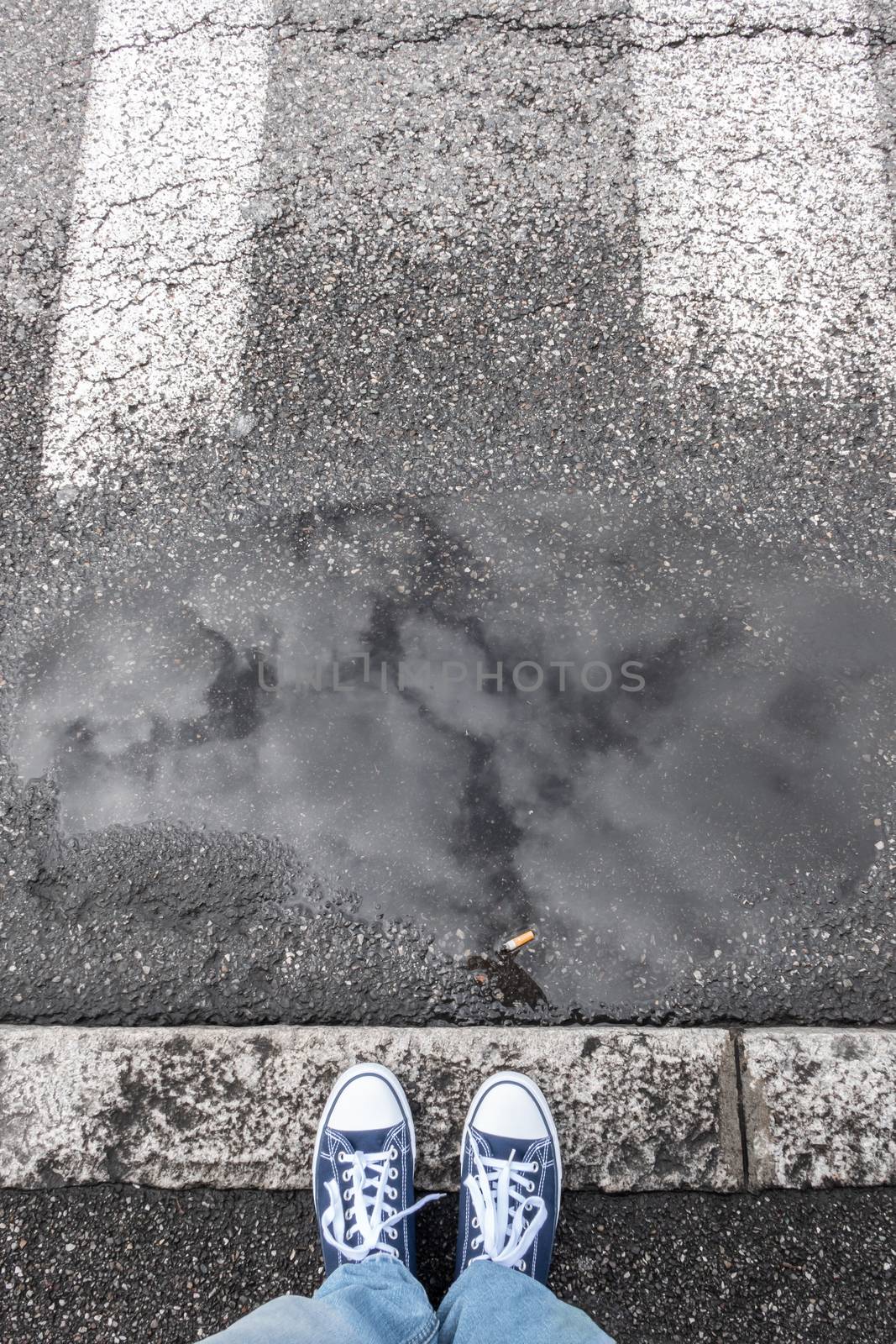 Feet on sidewalk by germanopoli