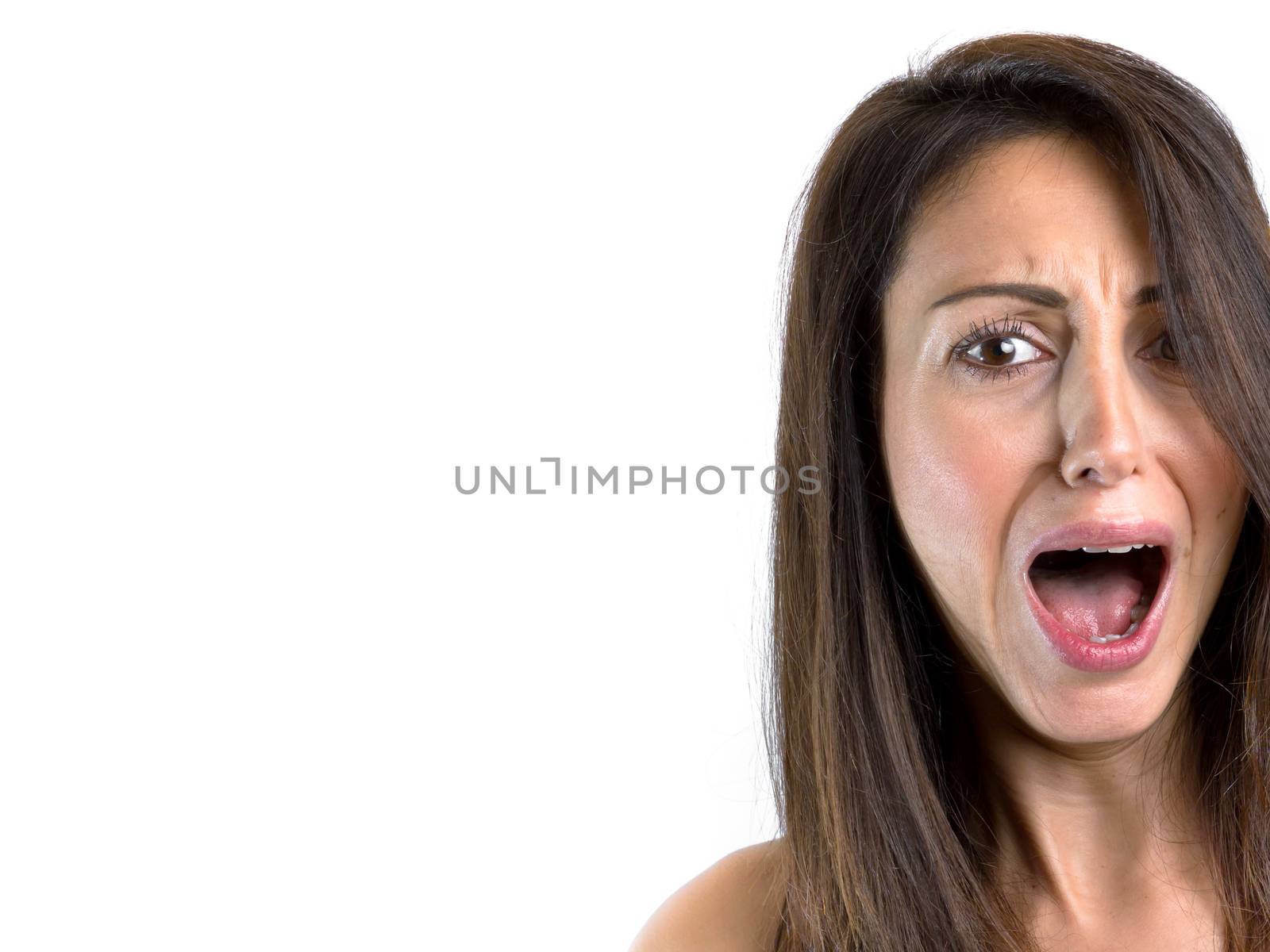 Portrait of a woman screaming on white background