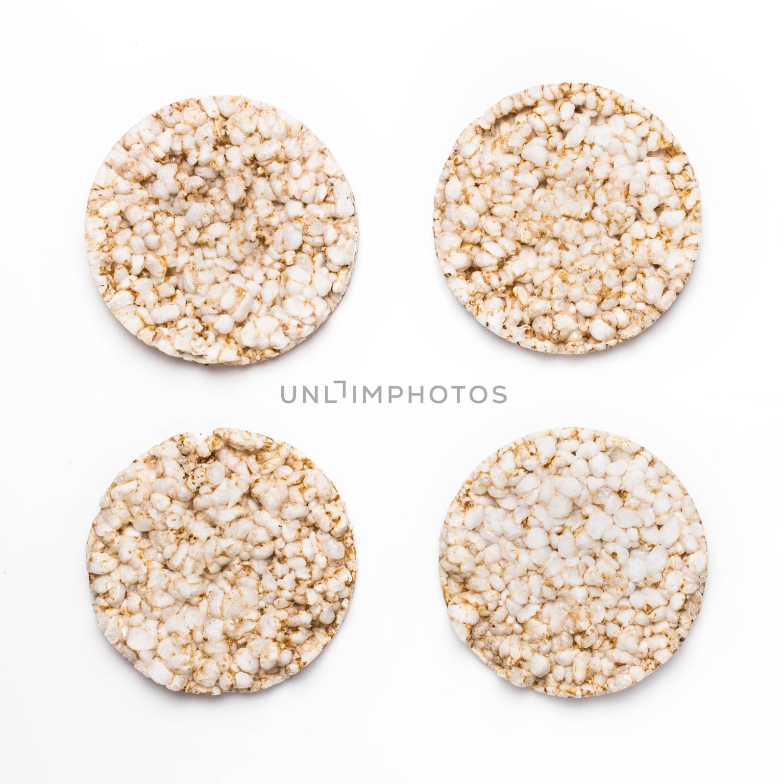 Four rice crackers isolated on white background. Concept of healthy eating and diet.