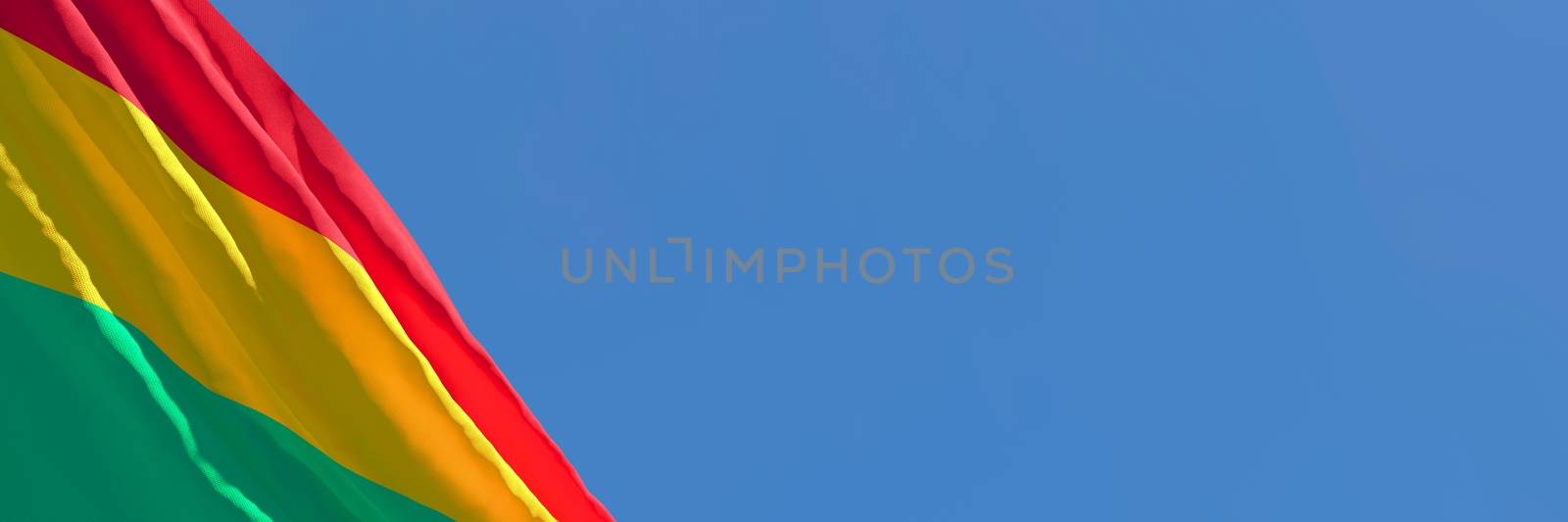 3D rendering of the national flag of Bolivia waving in the wind against a blue sky