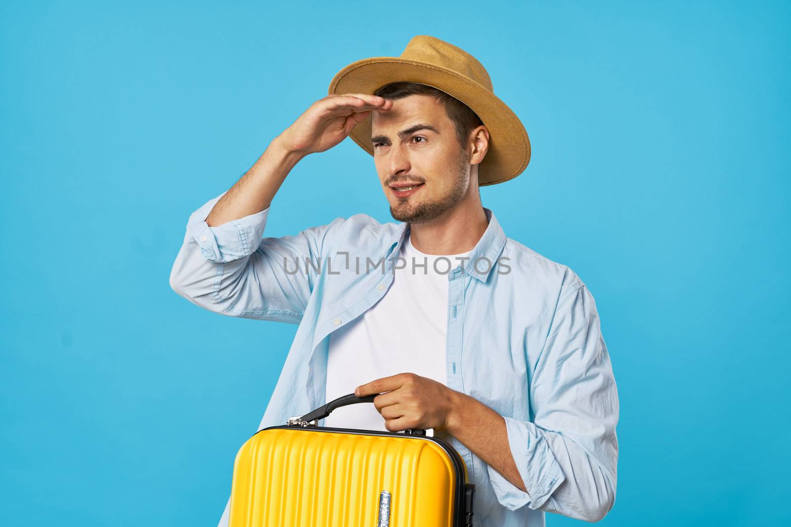 male tourists in hat with suitcase in hand travel adventure destination by SHOTPRIME