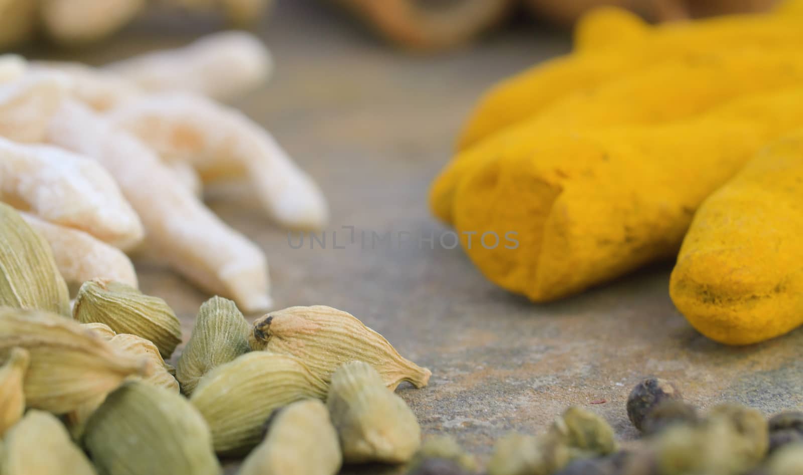 Macro shot spices on the table. Cardamom, turmeric. Extreme close up