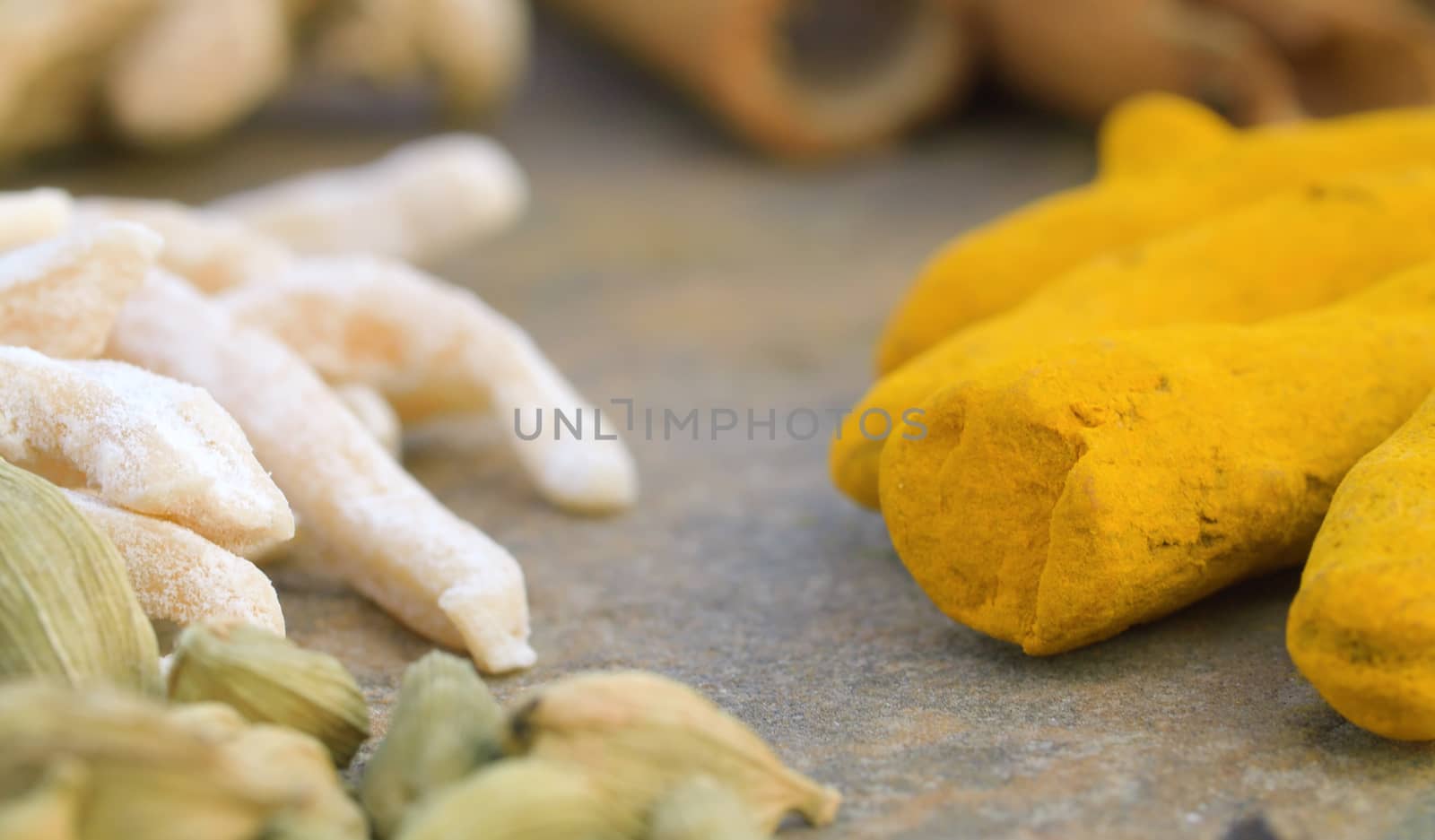 Macro shot spices on the table. Cardamom, turmeric, cinnamon. Extreme close up